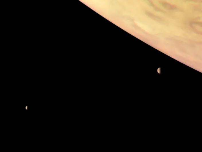 Io and Europa, Jupiter’s two largest moons, captured by NASA’s Juno spacecraft.