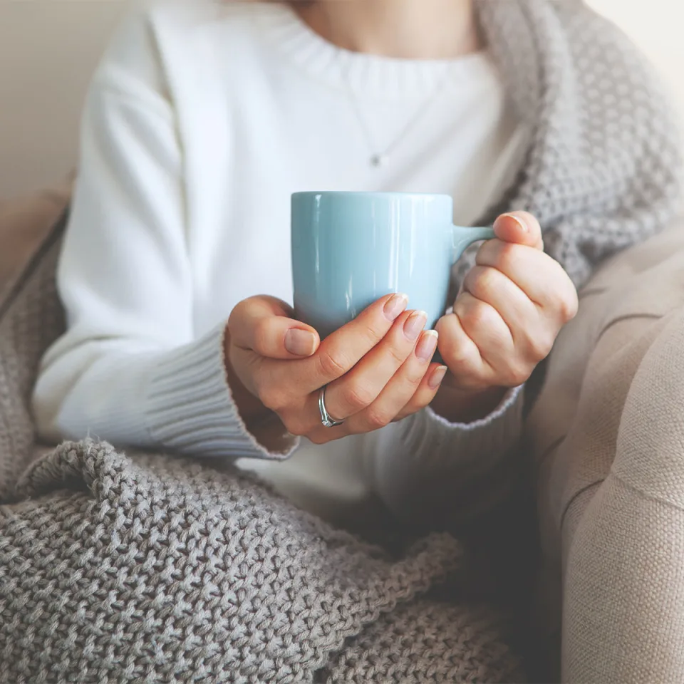 cozy-woman-holding-mug