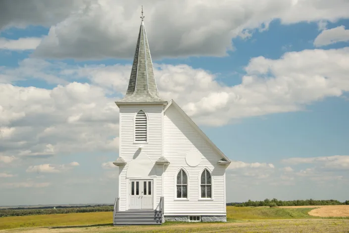 Image of an old-time prairie church. Joanna McCarthy via Getty Images